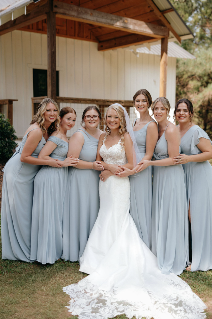 Bride with bridesmaids wearing blue dresses